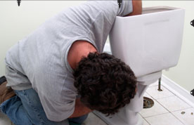 plumber-fixing-toilet